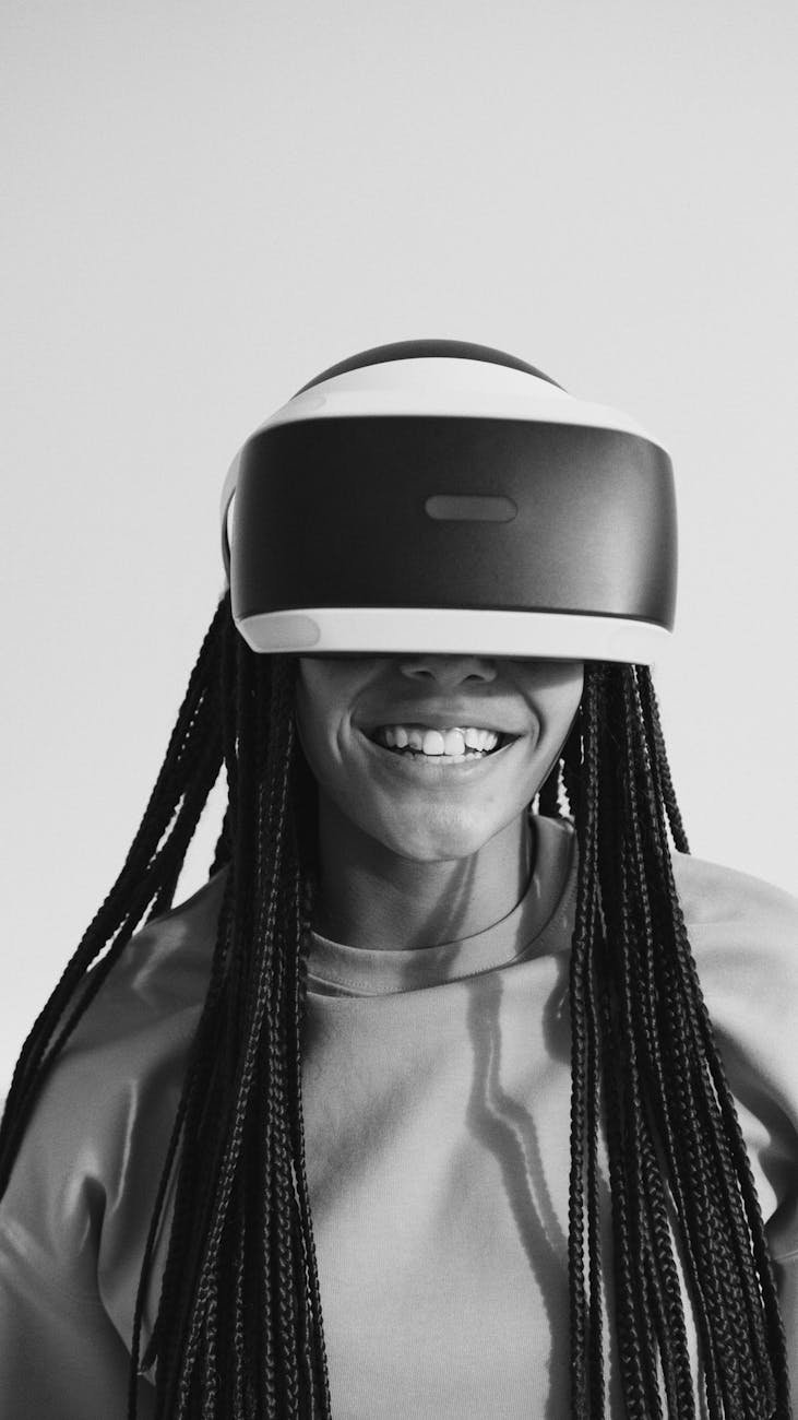grayscale photo of a woman wearing vr googles