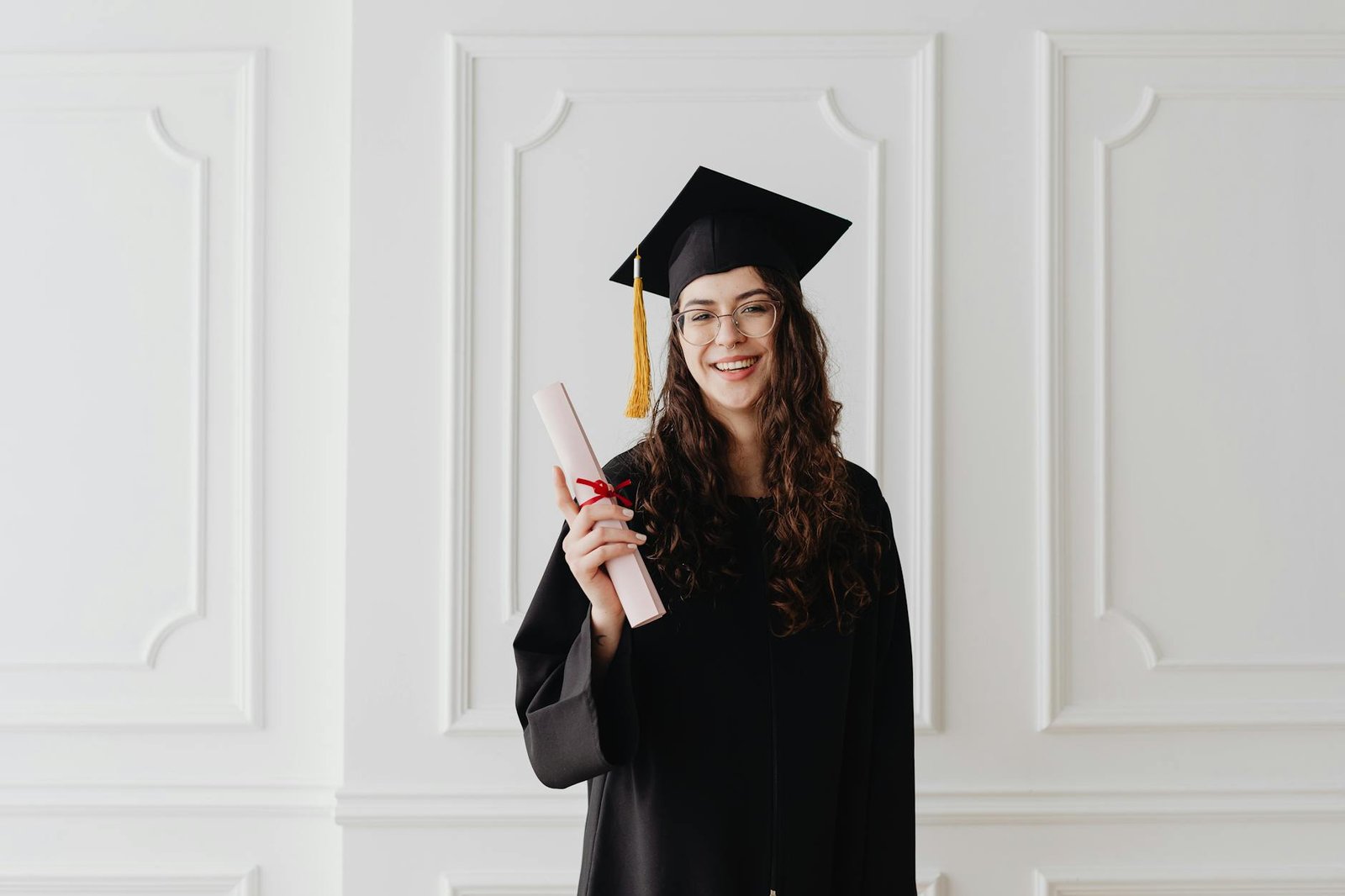 a woman wearing a graduation cap and gown